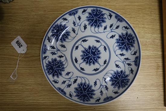 A Chinese blue and white lotus dish, Guangxu mark and period and a Chinese Swatow blue and white dish, 17th century (2)